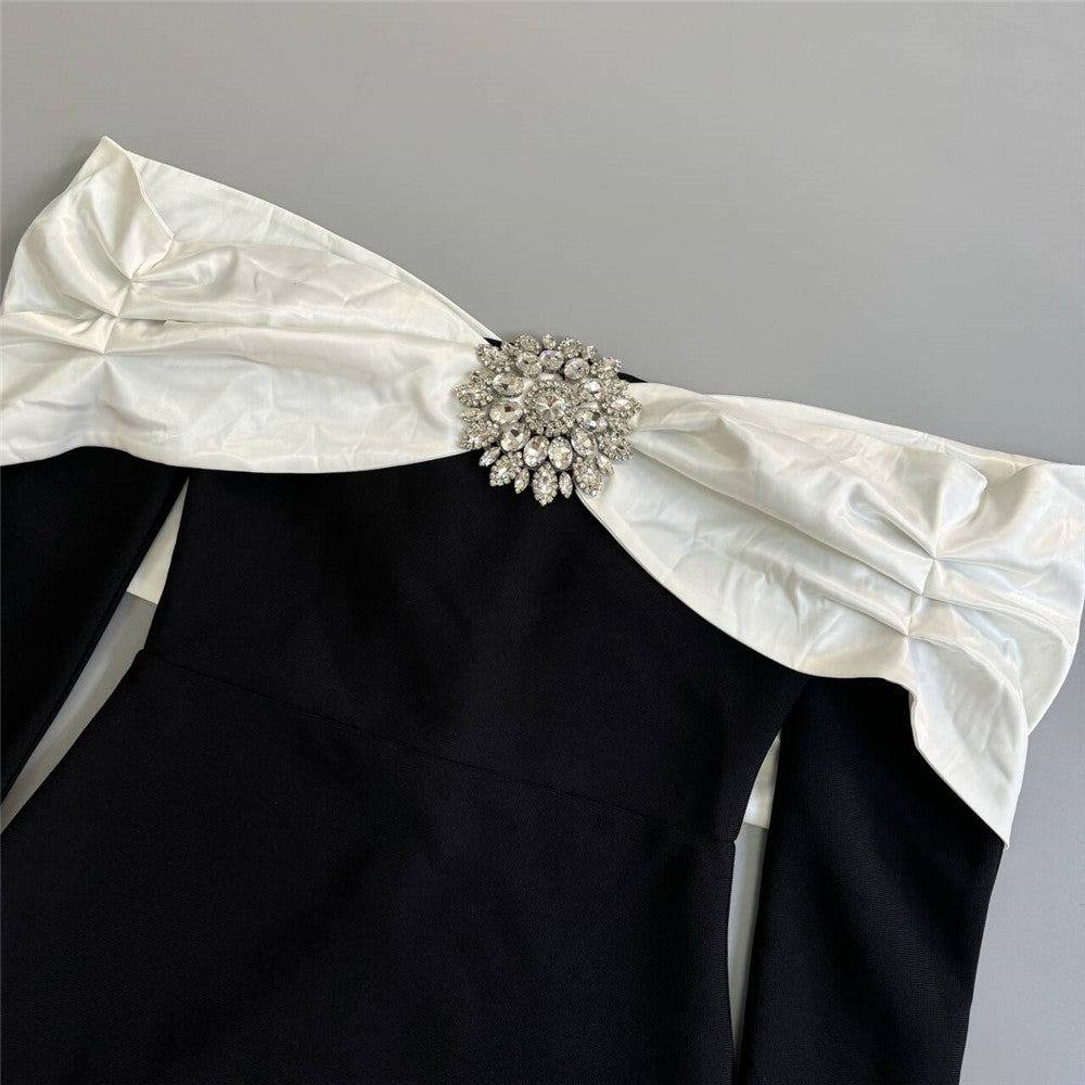 robe longue noire à décolleté dos nu et bandage diamant