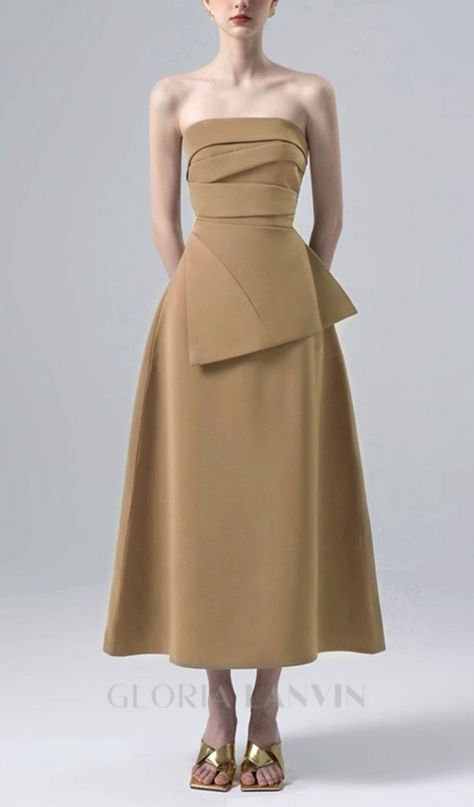 PLEATED ASYMMETRIC TUBE MIDI DRESS IN KAHKI