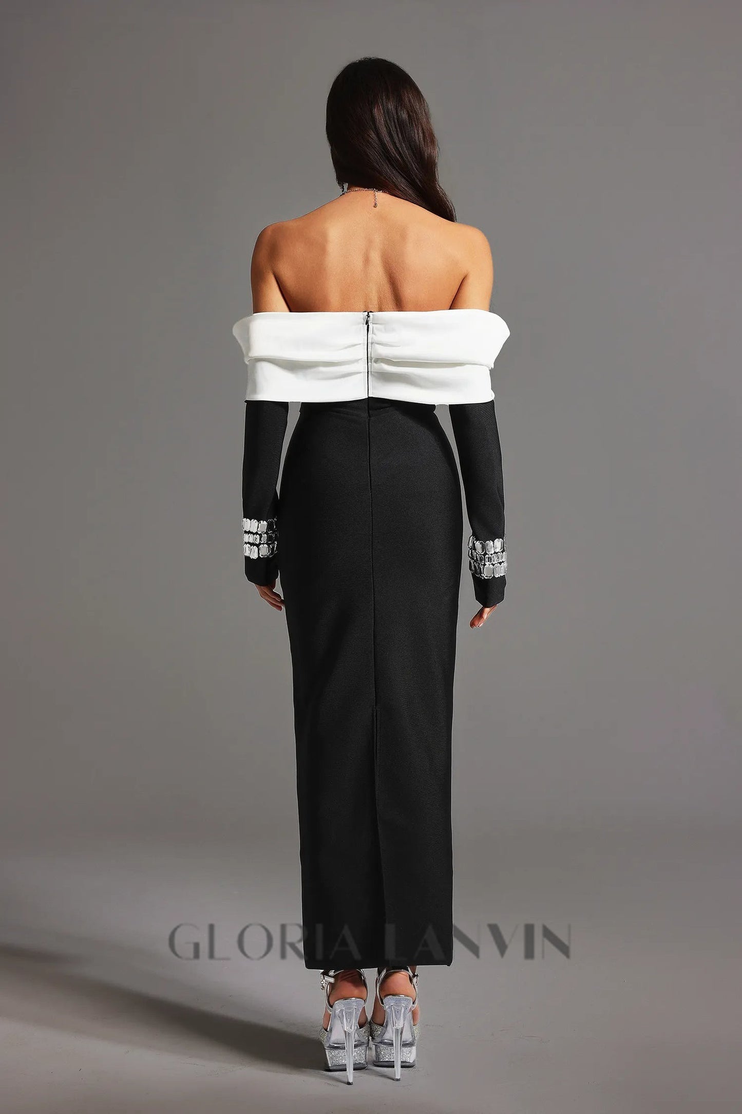 robe longue noire à décolleté dos nu et bandage diamant