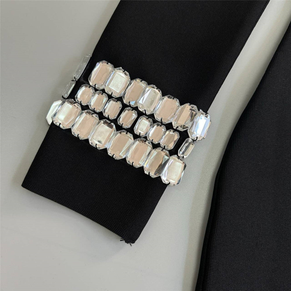 robe longue noire à décolleté dos nu et bandage diamant