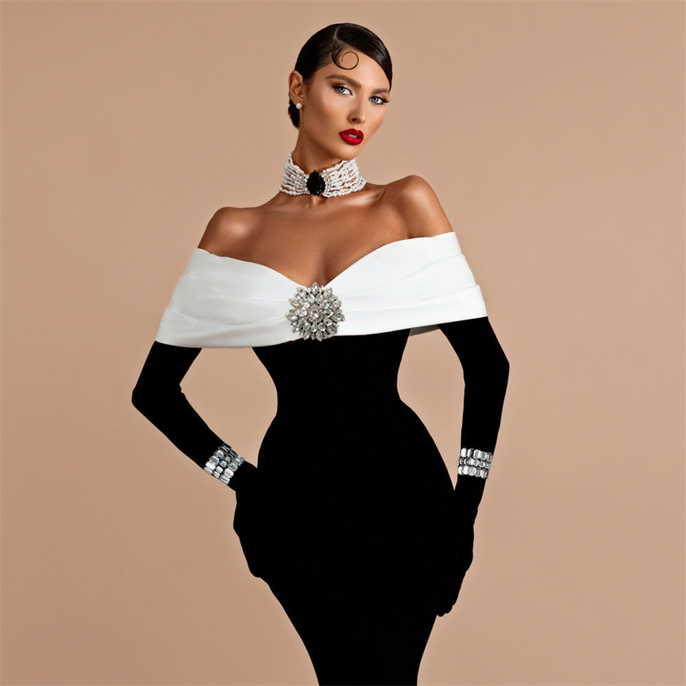 robe longue noire à décolleté dos nu et bandage diamant
