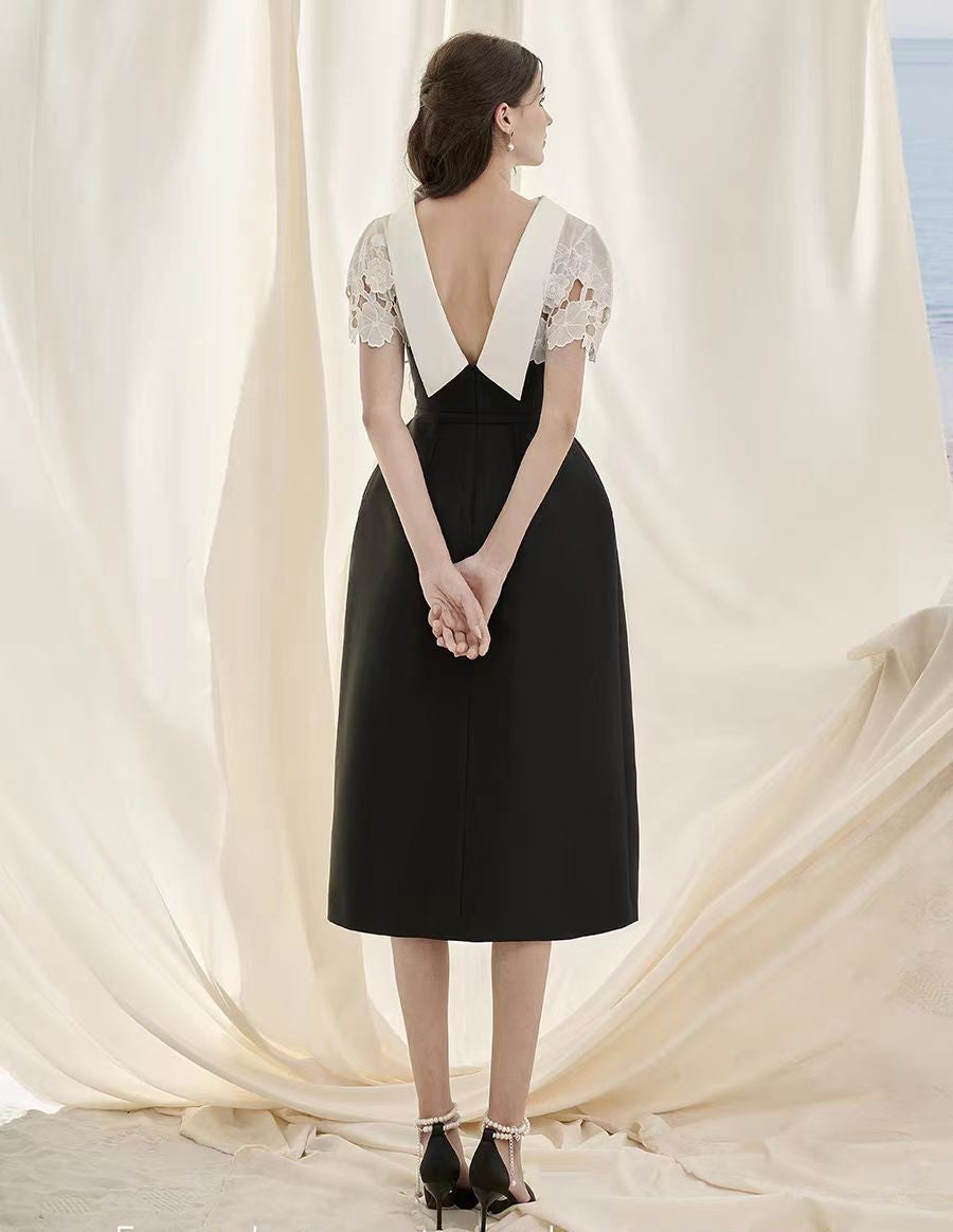 Schwarzes, schmal geschnittenes A-Linien-Midikleid aus durchbrochener Spitze