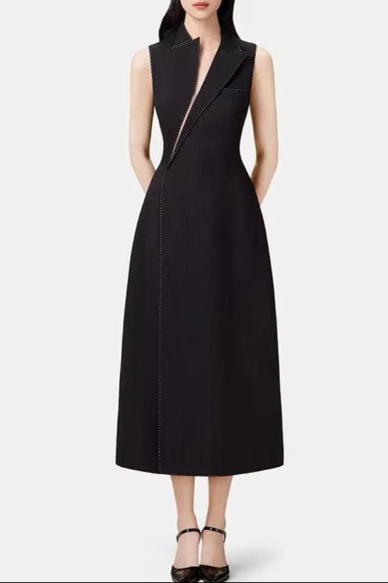 This image features a sophisticated and stylish asymmetric collar blazer midi dress in black. The dress exhibits a tailored fit and reaches midi length, providing an elegant silhouette.