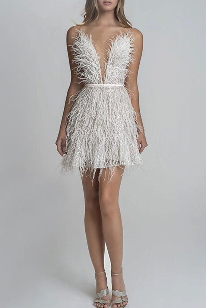 White feathered dress on a plain background