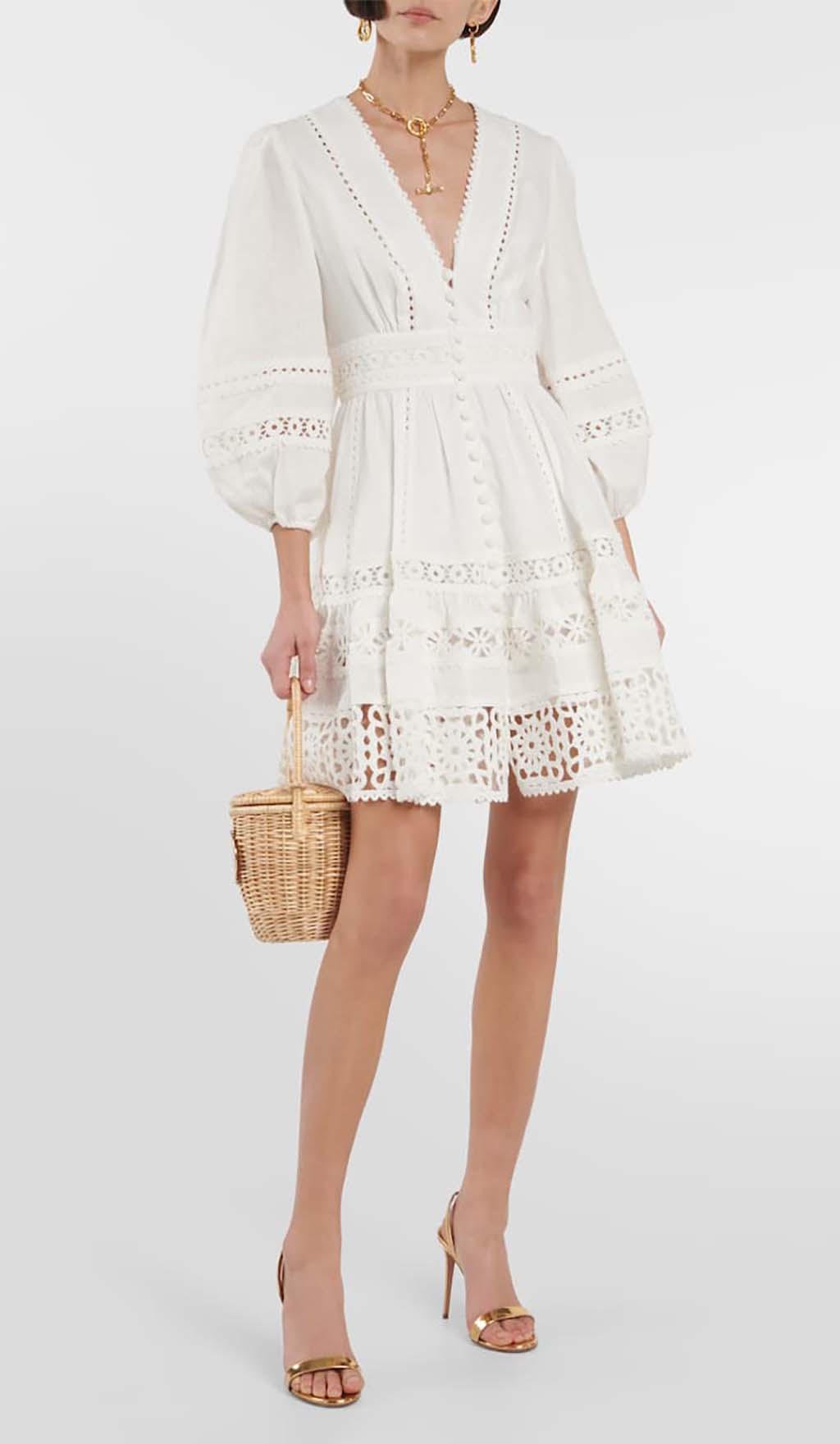 MINIKLEID AUS SPITZE MIT TIEFENAUSSCHNITT IN WEISS